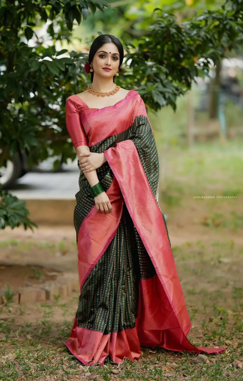 Delectable Green Soft Silk Saree With Confounding Blouse Piece